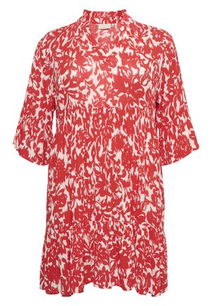 Rdeča in bela bluza s cvetličnim vzorcem, kratkimi zvonastimi rokavi, okroglim izrezom in razširjenim spodnjim robom. Narejena iz lahkotnega materiala.