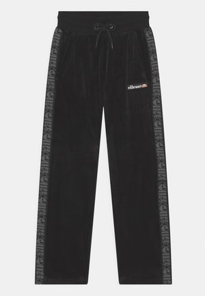 Pantalon de survêtement en velours noir avec taille élastique et cordon de serrage, doté de bandes latérales et d'un petit patch logo ellesse sur la cuisse.