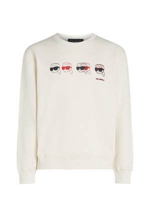Felpa crema con colletto rotondo, maniche lunghe e grafica frontale di volti illustrati che indossano occhiali da sole in rosso e nero.