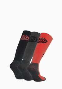 Three pairs of socks: black, dark grey, and red with a black circular logo. Knit material with a ribbed upper and reinforced heel sections.