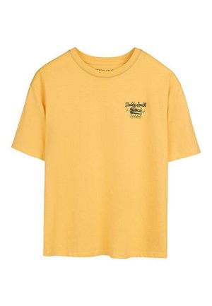 T-shirt jaune à manches courtes avec petit texte noir "Teddy Smith Eat & Smile" et dessin de hamburger sur le haut de la poitrine à gauche.