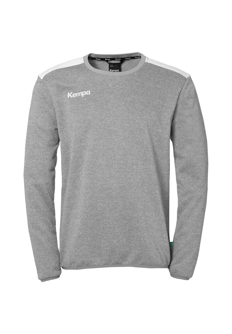 Grijze sweatshirt met lange mouwen en ronde hals, witte schouderaccenten en het "Kempa" logo op de borst. Gemaakt van een gestructureerde stof.