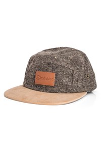 Brown patterned fabric cap with a suede beige brim and a leather patch label. Features metal ventilation eyelets on the sides.