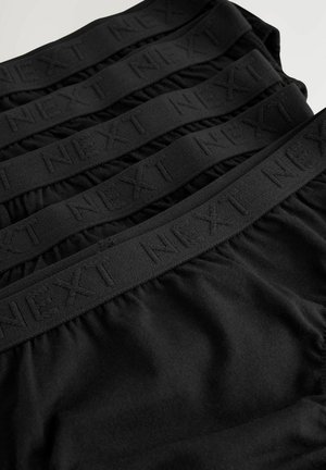 Sorte bomulds boxer shorts med en struktureret talje, der har det præget brandnavn "NEXT" i et gentaget mønster.