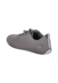 Gray textured athletic shoe with a breathable mesh upper, flat laces, and a flexible rubber sole featuring a patterned tread.