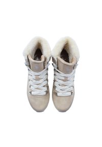 Beige suede hiking boots with white faux fur lining, metal hardware, and crisscross white laces. Features padded collar and textured outsole.