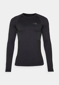Langärmliges, eng anliegendes schwarzes Sportshirt mit strukturierten Einsätzen, Rundhalsausschnitt und Logo auf der oberen linken Brust. Hergestellt aus dehnbarem, feuchtigkeitsableitendem Material.