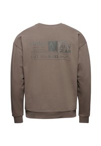 Brun sweatshirt med grafiskt tryck på baksidan med textdetaljer. Långa ärmar och ribbade muddar, tillverkad av mjukt och bekvämt material.