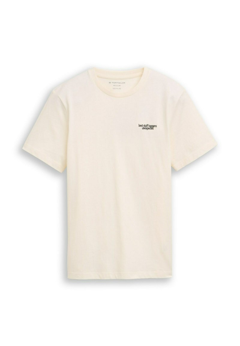 Cremfarbener Baumwoll-T-Shirt mit kurzen Ärmeln und Rundhalsausschnitt. Mit schwarzem Text "Die besten Dinge passieren unerwartet" auf der linken Brust.