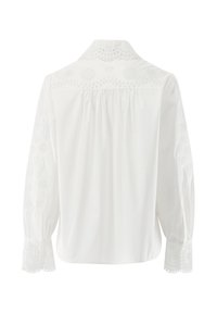White long-sleeve shirt with embroidered floral patterns on the sleeves and back. Features a pointed collar and buttoned cuffs. Smooth texture.
