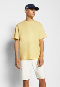 Weekday T-shirt básica - light yellow