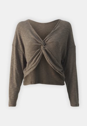 Brown, ribbed, long-sleeve top with a v-neck and twisted front detail; soft texture and cropped design.