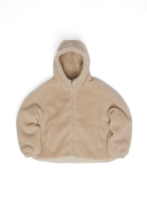Beige hooded fleece jacket with a zip front, raglan sleeves, and two side pockets. Soft texture, oversized fit, and no visible patterns.