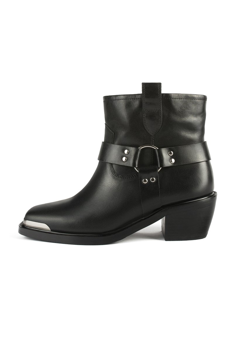 Black leather ankle boot with a high heel, featuring a wide leather strap with silver hardware and a pointed toe design.