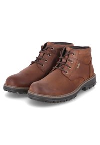 Bottines en cuir marron avec un bout arrondi, des lacets, des œillets métalliques et des semelles en caoutchouc texturé pour une meilleure traction.