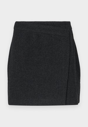 Black herringbone-patterned skirt with a wrap design, featuring a clean finish and textured fabric. Mid-thigh length.