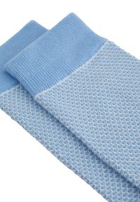 Gaiši zila kokvilnas zeķes ar tekstūrētu, šūnveida rakstu un ribotu maliņu. Dizains piedāvā kontrastējošas zilo toņu svītras.