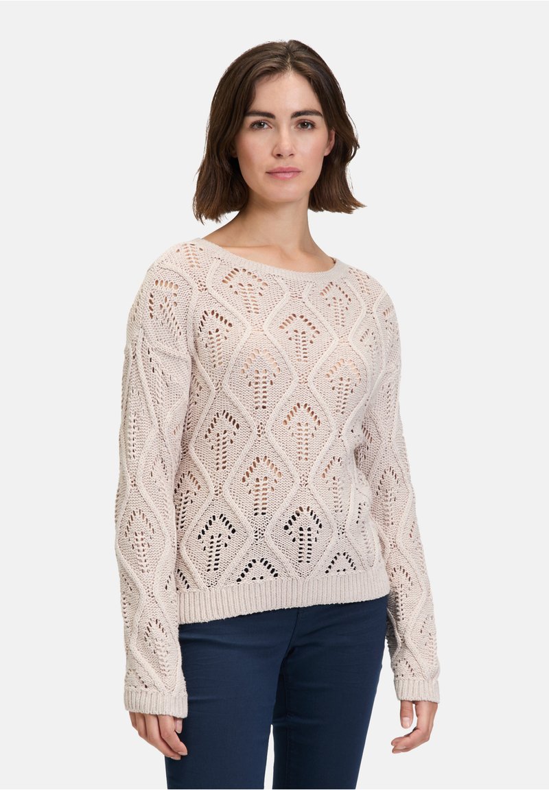 Pull en tricot beige clair avec un motif en diamant et un tissage ajouré. Présente des poignets et un ourlet côtelés, des manches longues et un col rond.