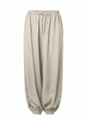 Pantalones beige de corte holgado con cintura elástica y puños en los tobillos, con cordón en la cintura para un ajuste regulable.