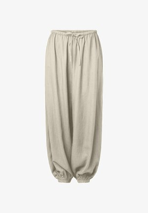 Bež široke hlače z elastičnim pasom in zapenjanjem na gležnjih, z vrvico za zavezovanje v pasu za nastavljivo prileganje.