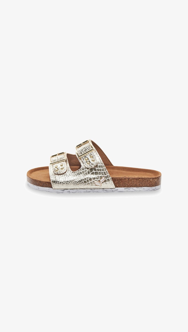 Gold, crocodile-textured slide sandal with dual buckles, padded footbed, and a cork midsole on a white rubber outsole.
