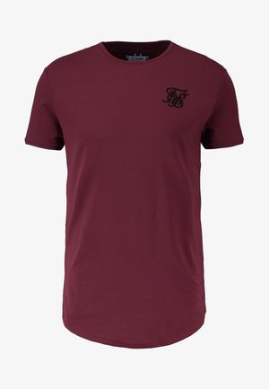 T-shirt bordeaux à manches courtes et col rond avec un logo stylisé brodé en noir sur le côté gauche de la poitrine.