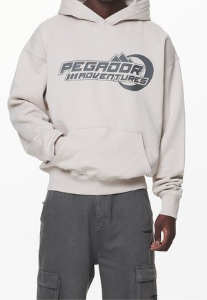 Pegador Jersey con capucha - sand
