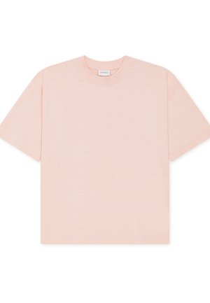 Vaaleanpunainen ylivuotoinen t-paita, joka on valmistettu pehmeästä puuvillasta. Siinä on lyhyet hihat ja pyöreä pääntie, yksinkertaisella ja saumattomalla muotoilulla.