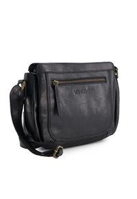Black leather crossbody bag with front zip pocket, adjustable strap, and embossed "VENEZIA" logo on the front pocket.