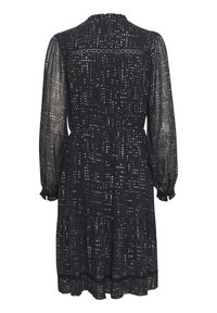 Rochie neagră cu mâneci lungi, umflate și cu tiv volanat. Prezentă un model cu puncte aurii și albe, cu o talie strânsă și o textură transparentă.