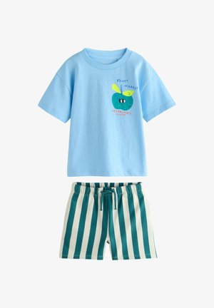 Light blue short-sleeve shirt with a green apple graphic and text paired with green and white vertical striped shorts with a drawstring waist.