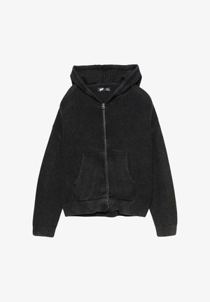 Crni zip-up dukserica s rebrastom teksturom, velikim prednjim džepovima i opuštenim krojem. Uključuje prostranu kapuljaču.