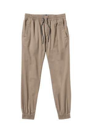 Beige casual jogger pants with elastic waistband, drawstring, side pockets, and elastic cuffs at the ankles.
