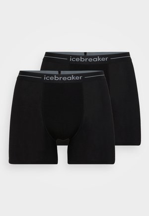 Juodi bokso šortai pagaminti iš minkštos medžiagos, su juodu elastingu juosmeniu, kuriame yra "icebreaker" logotipas, ir aptemptu dizainu.