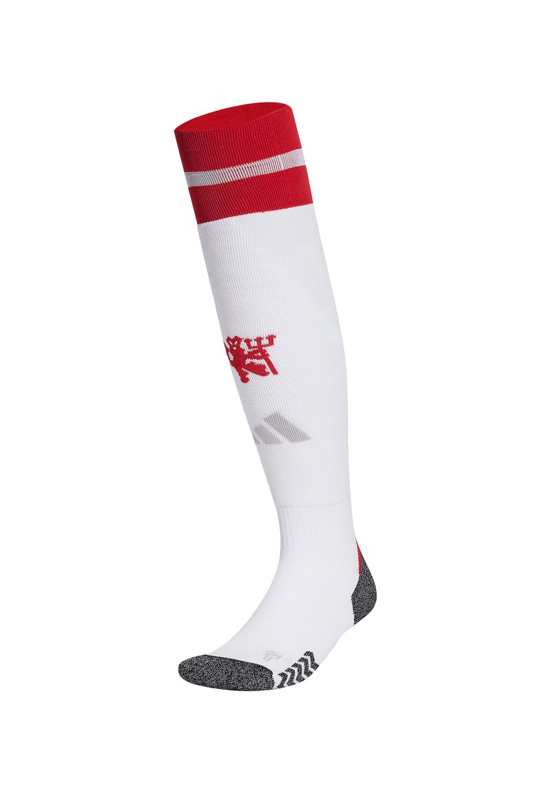Calcetín deportivo blanco con puño a rayas rojas y blancas, que presenta un emblema de un león rojo y una parte del pie acolchada en gris con un patrón de agarre texturizado.