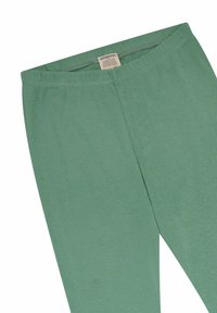 Helle grüne Leggings aus einer weichen Baumwollmischung, mit einem elastischen Taillenbund und nahtlosem Design. Pflegeetikett innen sichtbar.