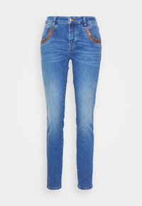 Slim-fit blue jeans made of denim, featuring two pockets with brown decorative stitching. The front has a small metal button and zipper.