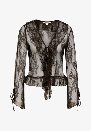 Blouse noire en dentelle transparente avec manches longues, encolure en V à volants, fermetures à nouer sur le devant, et ourlet ainsi que poignets à volants.