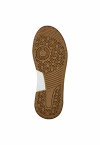 Semelle d'une chaussure marron avec des motifs circulaires et striés, une étiquette de taille blanche marquée 37, et le nom de la marque Tamaris visible.