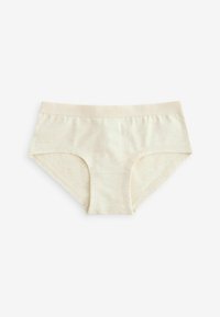 Slip in cotone di colore crema chiaro con una texture morbida. Presenta una cintura elastica ampia con il nome del marchio impresso. Taglio classico.