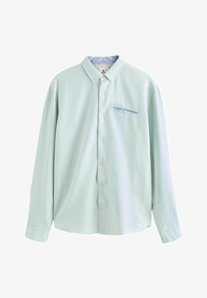 Camicia a maniche lunghe di colore verde chiaro con un motivo testurizzato, colletto a contrasto e una piccola tasca sul petto con una striscia blu.
