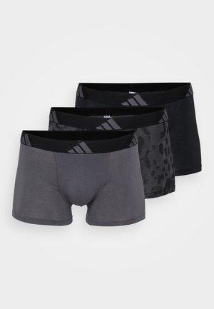 Tre paia di boxer da uomo: uno grigio uniforme, uno nero con stampa leopardata e uno nero uniforme. Ognuno presenta un elastico in vita nero.