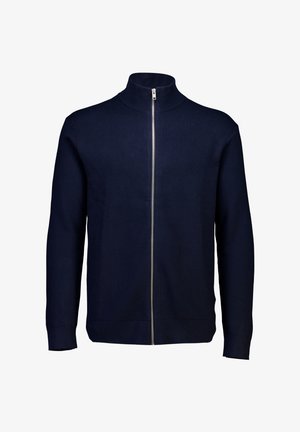 Granatowy golf zapinany na zamek wykonany z dzianiny. Posiada wysoki kołnierz oraz długie rękawy, gładką fakturę oraz zamek błyskawiczny na całej długości z przodu.