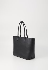Black rectangular tote bag with two shoulder straps, smooth leather texture, standing upright on a plain white background.