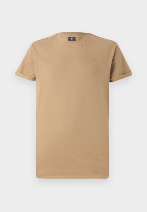 Beige Kurzarm-T-Shirt aus weicher Baumwolle mit Rundhalsausschnitt und umgeschlagenen Ärmeln, versehen mit einem kleinen Logo auf der Brust.
