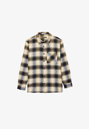 Flanellipaita keltaisen, laivastonsinisen ja valkoisen ruudullisen kuvion kanssa. Mukana nappikaulus ja yksi rintatasku. Pitkät hihat nappilärpäkkeillä.