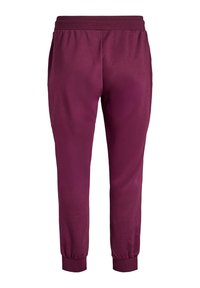 Burgunderfarbene Sport-Jogginghosen mit einem dehnbaren Bund, elastischen Bündchen und einer glatten Textur, die ein tailliertes Bein-Design aufweisen.