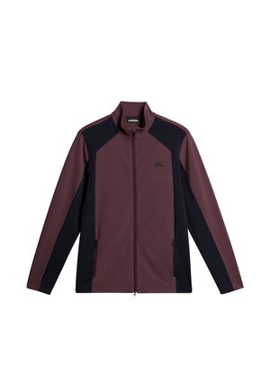 Bordeaux-rood en zwarte ritjacket met een staande kraag, voorzien van contrasterende zijpanelen en twee voorzakken met rits. Zachte, gladde stoftextuur.