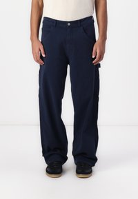 Navy blue cargo pants with a relaxed fit, featuring side pockets, a button closure, and a smooth texture. Suitable for casual wear.