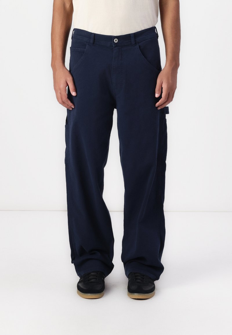 Navy blue cargo pants with a relaxed fit, featuring side pockets, a button closure, and a smooth texture. Suitable for casual wear.